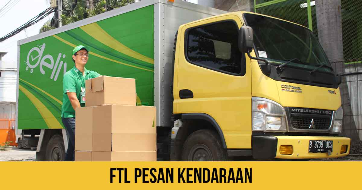 Supir Deliveree bawa barang didepan truk engkel warna kuning