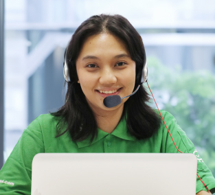 A customer service girl with green shirt smiling