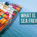 A cargo ship sailing with containers from a bird's eye view and the text what is sea freight