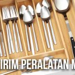 Laci penyimpanan berisi peralatan makan seperti sendok, garpu, dan spatula yang tertata rapi.